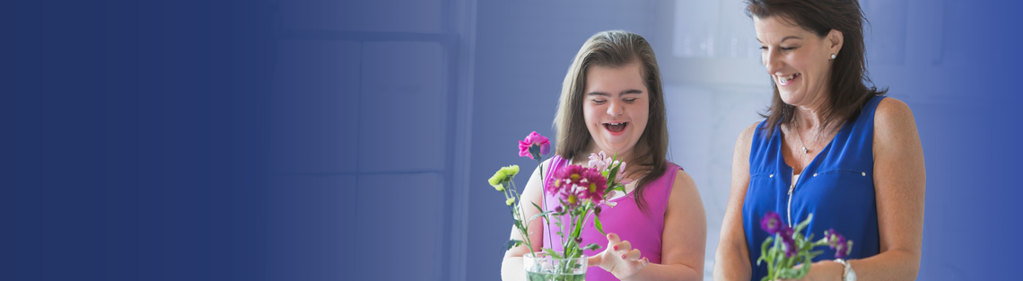 woman and girl holding flowers