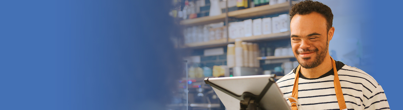 Young man watering plants