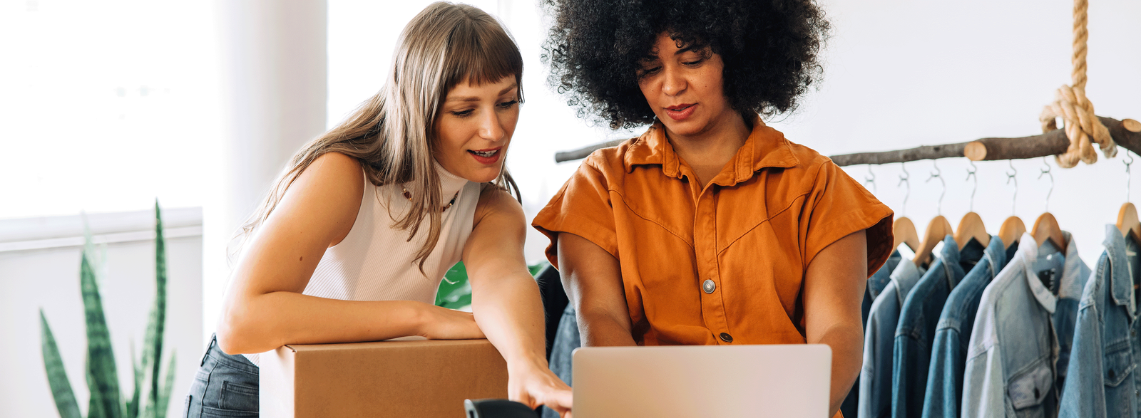 Woman with two small children and a computer