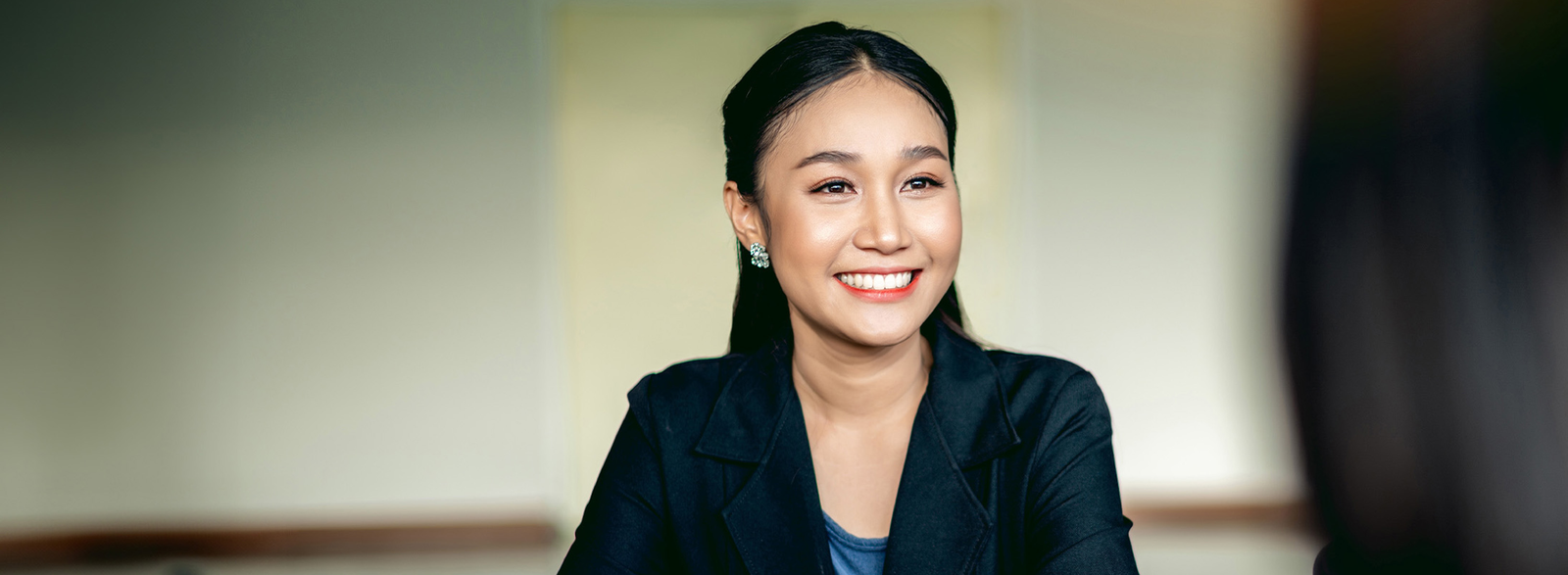 Smiling woman in a suit