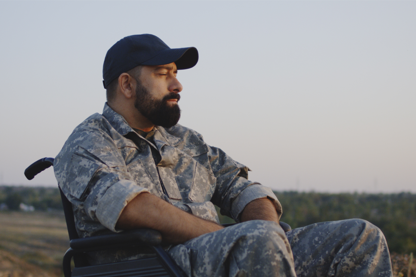 an in fatigues sitting in a wheelchair